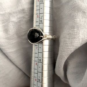 Silver ring with black bead